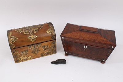 Lot 901 - A Victorian walnut stationery box, the domed hinged cover with brass strapwork detailing enclosing a divided interior, together with a Regency sarcophagus tea caddy and a lacquered shoe snuff box (...