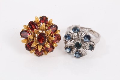 Lot 170 - Four gem set cluster rings to include two silver sapphire cocktail rings, one other similar and a gilt metal garnet ring