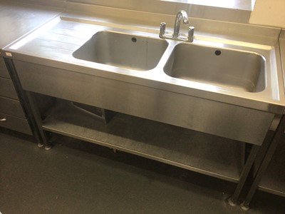 Lot 28 - A stainless steel double bowl sink unit, with mixer tap and undershelf, 1500 mm