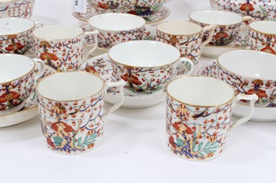 Lot 244 - An early 19th century Crown Derby tea set, decorated in the Imari style, including teapot and stand, sucrier, bowl, seven saucers, eight coffee cans, and eight tea cups