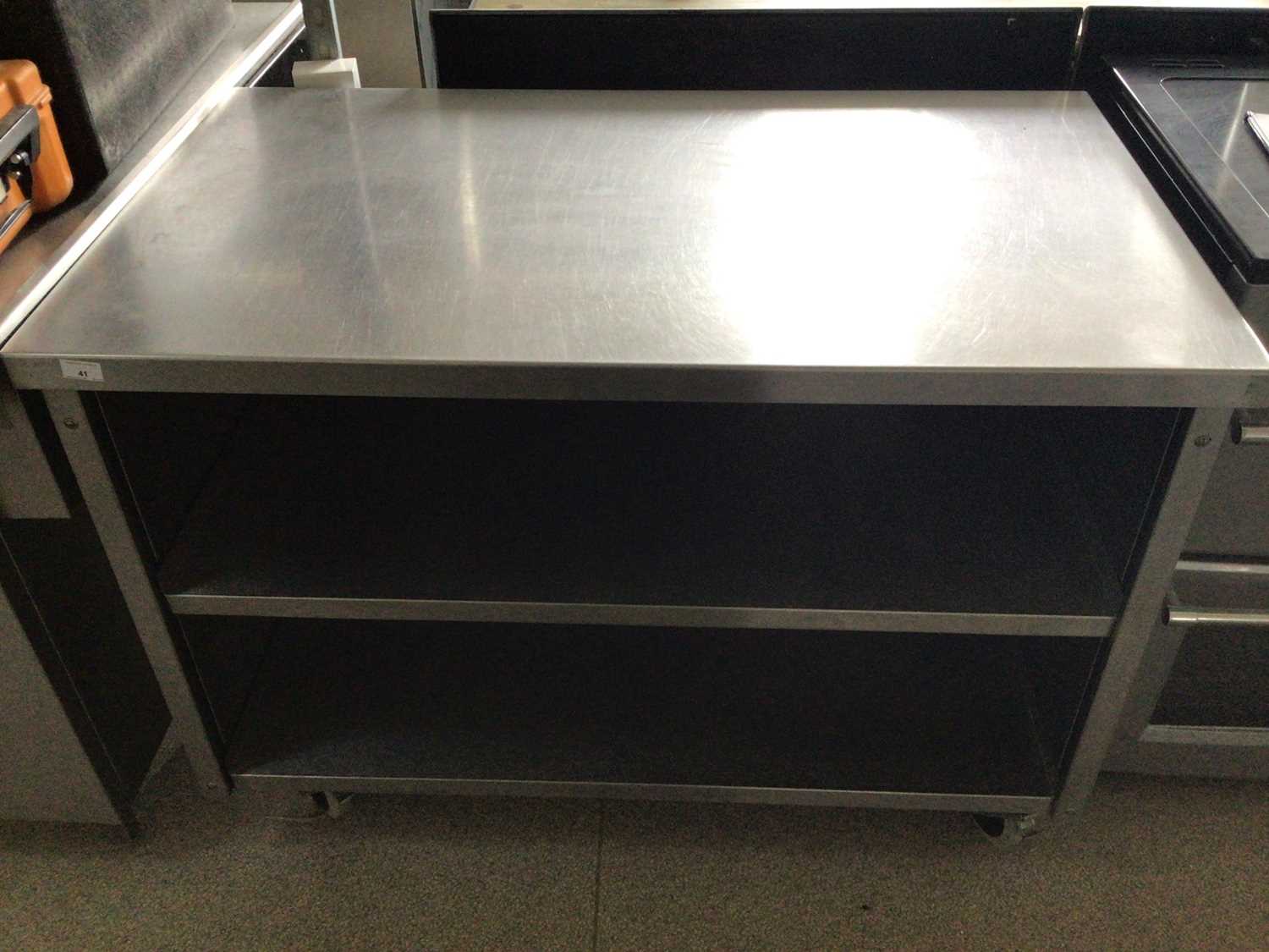 Lot 41 - A freestanding stainless steel preparation bench, with two shelves under, on castors, 1200 mm