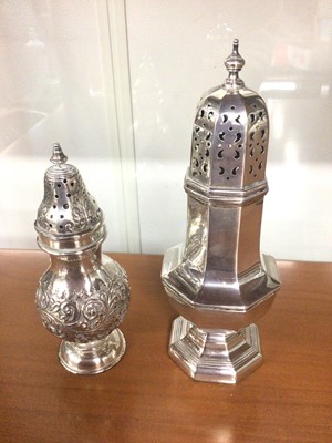 Lot 814 - Two silver sugar castors