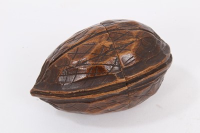 Lot 914 - 19th century novelty miniature globe, approximately 3cm diameter, partially incomplete, housed within a carved nut, probably Black Forest