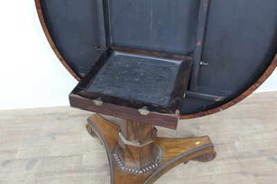 Lot 1401 - William IV rosewood circular breakfast table, the tilt top with beaded edge on facetted column and shaped triangular platform on scroll feet, 123cm diameter