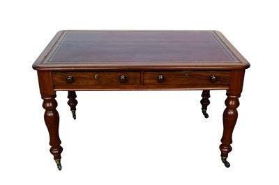 Lot 1410 - Victorian mahogany library table, with tooled red leather top and two frieze drawers on turned legs and castors, 123cm wide x 73cm deep x 74cm high