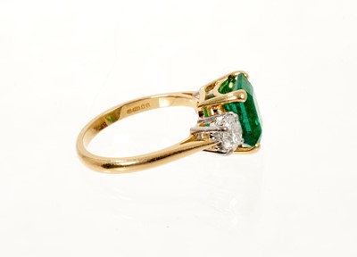 Lot 629 - A fine emerald and diamond three stone ring