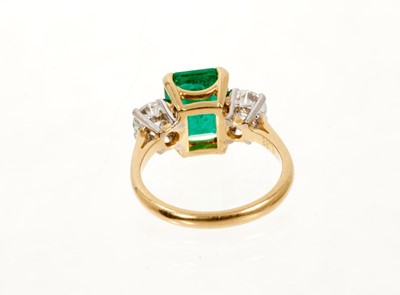 Lot 629 - A fine emerald and diamond three stone ring