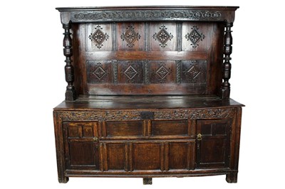 Lot 1421 - Very large 18th century and later court cupboard, with panelled canopy superstructure raised on cup and cover supports, the base with hinged top and knotwork carved frieze, initialled and dated 170...