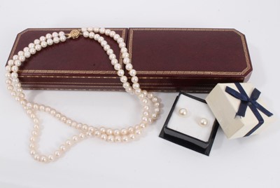 Lot 794 - Pair of saltwater cultured pearl studs earrings with Mikimoto 14ct gold fittings and a cultured pearl two strand necklace with 14ct gold clasp