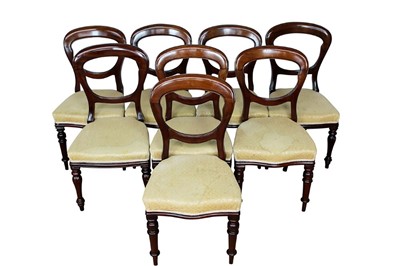 Lot 1426 - Set of eight Victorian mahogany balloon back dining chairs, each with cream silk upholstery on turned tapered legs