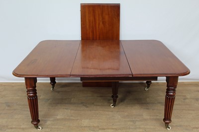 Lot 1435 - Victorian mahogany extending dining table, with rounded rectangular top on reeded legs and castors, to include pair of additional leaves, 218 x 117cm extended