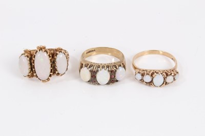 Lot 193 - 9ct gold opal three stone ring with carved scroll shoulders, opal and rugby ring and an opal five stone ring