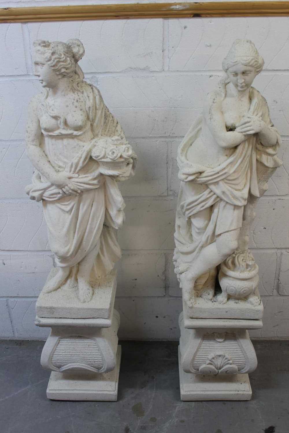 Lot 1445 - Pair of vintage white painted composition garden statues on bases