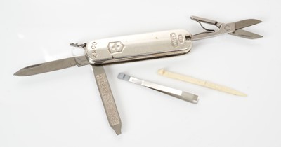 Lot 475 - Contemporary silver mounted Swiss army knife by Tiffany & Co. and Victorinox, with knife, scissors, file, toothpick and tweezers, marks for Tiffany & Co, length 6cm.