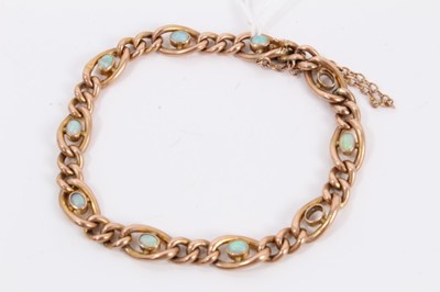 Lot 608 - Edwardian 9ct rose gold curb link bracelet set with eight opal cabochons (two missing)