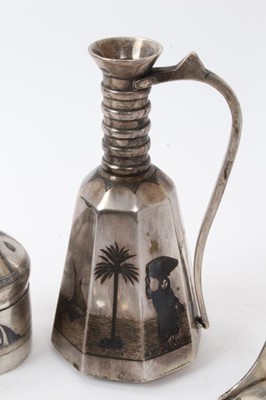 Lot 484 - Collection of Iraqi white metal and niello wares to include ewer, teaspoons, sugar tongs and other items (11)