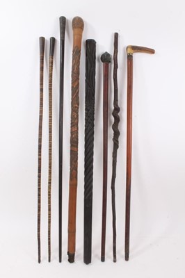 Lot 1018 - Collection of antique walking canes, including pair of sectional horn canes, 83cm long, Japanese carved bamboo stick, various others, (8)