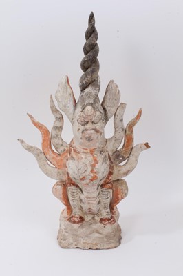 Lot 288 - A Chinese painted pottery tomb guardian Zhenmushou figure, probably Tang period, modelled seated with a spiral horn, 44cm high