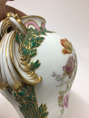 Lot 291 - A Minton Sevres-style vase and cover, circa 1850-70, polychrome decorated with flowers and exotic birds, on a green and pink ground with scrollwork handles, ermine mark to base, 32cm high