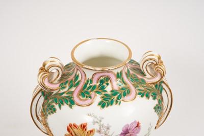 Lot 291 - A Minton Sevres-style vase and cover, circa 1850-70, polychrome decorated with flowers and exotic birds, on a green and pink ground with scrollwork handles, ermine mark to base, 32cm high