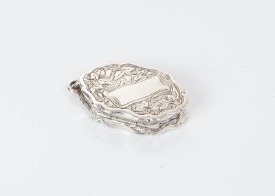 Lot 497 - Victorian silver vinaigrette of oval form with engraved decoration, gilded interior with pierced hinged grill, (London 1880), maker George Unite, 3.6 cm