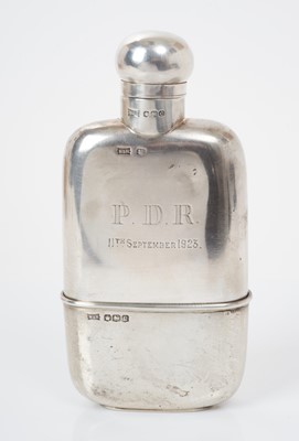 Lot 514 - George V silver hip flask with removable cup gilded to interior, the body engraved 'P.D.R. 11th September 1923', (Sheffield 1920), maker Walker & Hall, all at 5.3ozs, 14.7cm in length.