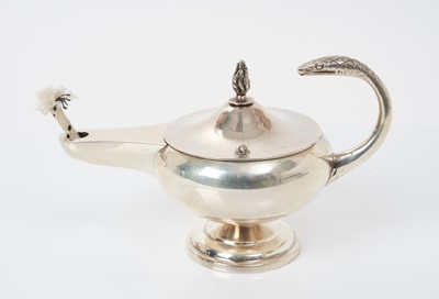 Lot 516 - George V silver table lighter in the form of an aladdin lamp with snake handle and flame topped wick holder