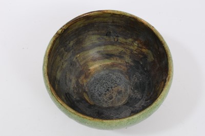 Lot 324 - Two early Chinese green / celadon glazed bowls, one with a ribbed body, the other with incised pattern around the rim, 12cm and 13cm diameter