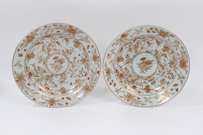 Lot 327 - A good pair of 18th century Japanese Edo period Imari plates, decorated in gilt and red enamel with a pattern of birds and flowers, 26cm diameter