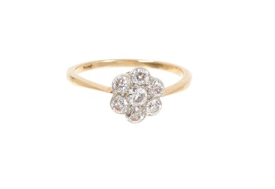 Lot 714 - Antique diamond cluster ring with a daisy flower head cluster of seven old cut diamonds in platinum millegrain setting on 18ct yellow gold shank. Estimated total diamond weight approximately 0.70ct...