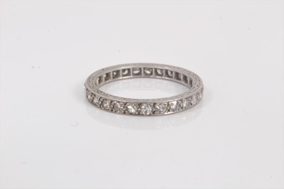 Lot 716 - Diamond eternity ring with a full band of single cut diamonds in white gold setting, ring size N.