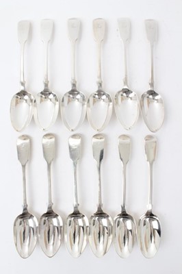 Lot 528 - Set of twelve Victorian silver fiddle pattern table spoons, each with engraved crest, (London 1840), maker George Adams, all at 32ozs