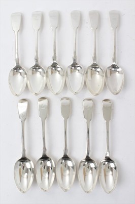 Lot 529 - Set of eleven Victorian silver fiddle pattern table spoons, each with engraved crest, (London 1840), maker George Adams, all at 17ozs