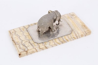 Lot 1068 - Fossilised mammoth tooth paperweight, mounted with a silver model of an elephant