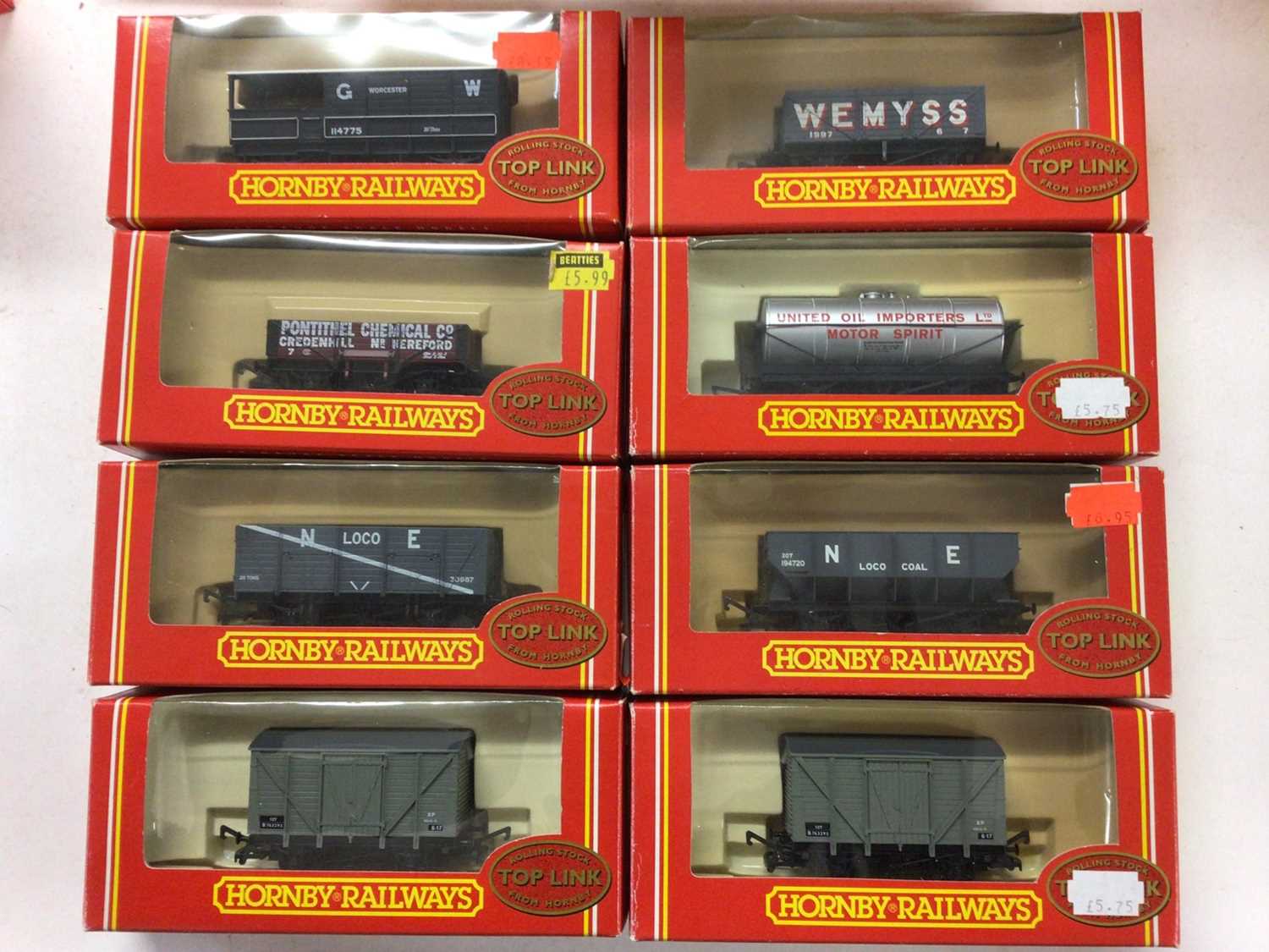 Lot 155 - Hornby OO gauge rolling stock including Top Link (x9) Banana Vans (x3), Open Wagons (x3), Railiner Curtain Sided Vans (x3) plus branded hopper, brake and tank wagons and vans, all boxed (40)