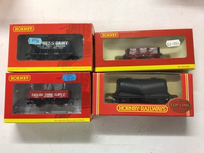 Lot 155 - Hornby OO gauge rolling stock including Top Link (x9) Banana Vans (x3), Open Wagons (x3), Railiner Curtain Sided Vans (x3) plus branded hopper, brake and tank wagons and vans, all boxed (40)
