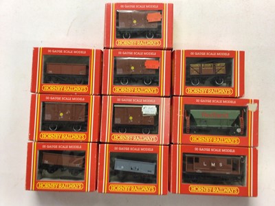 Lot 155 - Hornby OO gauge rolling stock including Top Link (x9) Banana Vans (x3), Open Wagons (x3), Railiner Curtain Sided Vans (x3) plus branded hopper, brake and tank wagons and vans, all boxed (40)