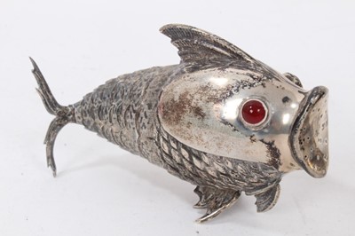Lot 538 - Pair of Spanish silver articulated fish pepperettes set with red and green cabochon eyes, marked under fins, each 9.5cm in length.
