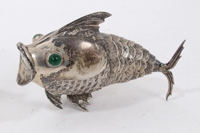 Lot 538 - Pair of Spanish silver articulated fish pepperettes set with red and green cabochon eyes, marked under fins, each 9.5cm in length.