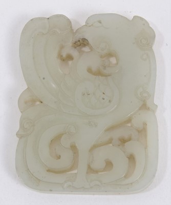 Lot 1039 - Carved pale celedon jade plaque, with stylised phoenix, 6cm high