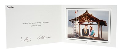 Lot 131 - T.R.H. The Duke and Duchess of Cambridge (now TRH The Prince and Princess of Wales) signed 2012 Christmas card with twin silvered ciphers to cover, charming photograph of Prince William and Catheri...