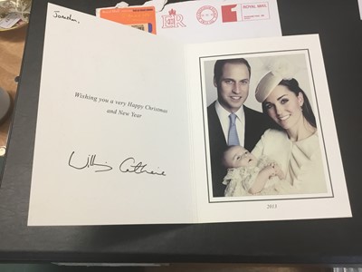 Lot 132 - T.R.H. The Duke and Duchess of Cambridge (now TRH The Prince and Princess of Wales) signed 2013 Christmas card with twin silvered ciphers to cover, charming photograph of Prince William and Catheri...