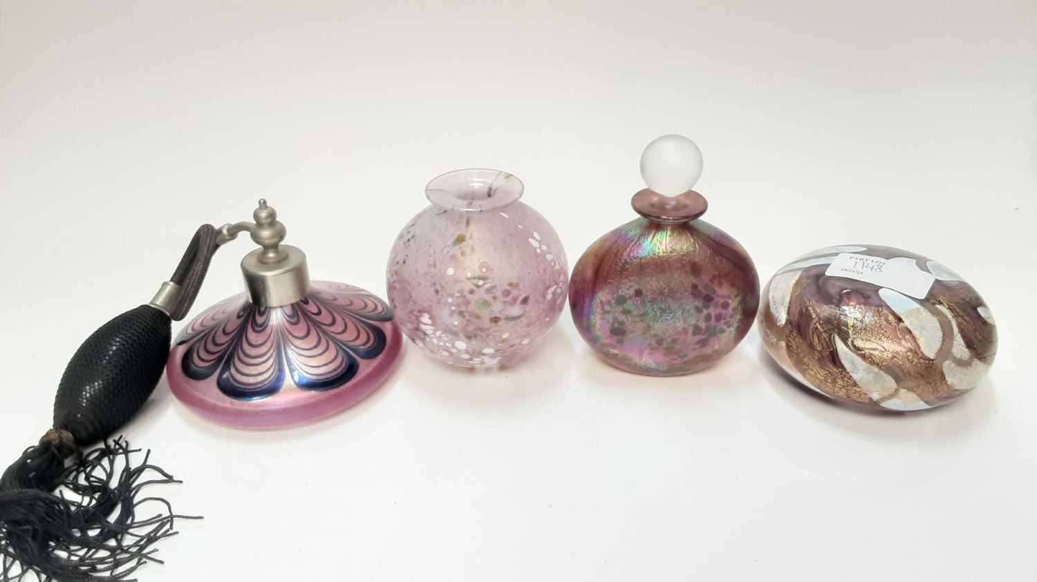 Lot 1148 - Isle of Wight iridescent scent bottle, paperweight and vase, all with original labels, together with a Glasform atomiser (4)