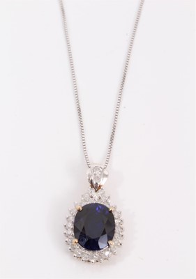 Lot 53 - 18ct gold synthetic oval blue stone and diamond cluster pendant on 14ct white gold chain
