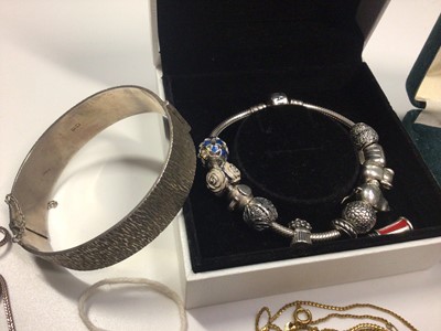 Lot 58 - 1960s silver bangle, silver ingot pendant on chain, other jewellery and Pandora charm bracelet in box