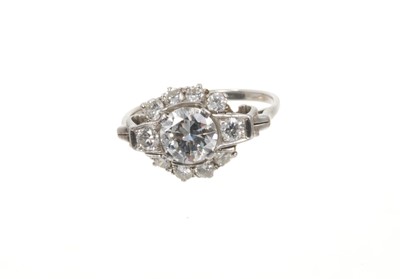 Lot 698 - Art Deco diamond ring, the cluster with a central transitional old cut diamond estimated to weigh approximately 1.17cts flanked by further old brilliant cut diamonds with scroll shoulders on platin...