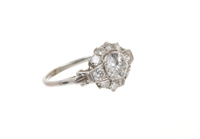 Lot 698 - Art Deco diamond ring, the cluster with a central transitional old cut diamond estimated to weigh approximately 1.17cts flanked by further old brilliant cut diamonds with scroll shoulders on platin...