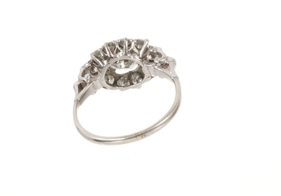 Lot 698 - Art Deco diamond ring, the cluster with a central transitional old cut diamond estimated to weigh approximately 1.17cts flanked by further old brilliant cut diamonds with scroll shoulders on platin...