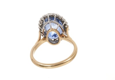 Lot 699 - Sapphire and diamond cluster ring with a pear-cut cornflower blue sapphire measuring approximately 12.1mm x 8.8mm x 11.3mm surrounded by a border of old cut and single cut diamonds in platinum sett...