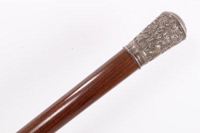 Lot 1051 - Impressive 19th century Anglo-Indian silver mounted walking stick, the silver terminal embossed with a continuous frieze of animals in a jungle, tapering rosewood staff, 89cm long